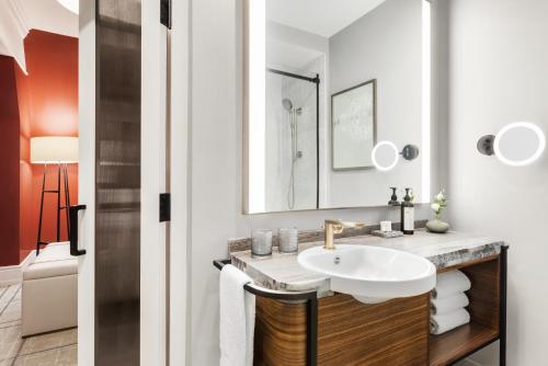 a bathroom with a sink and a mirror at Fairmont Banff Springs in Banff