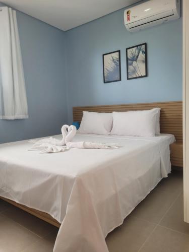 Giường trong phòng chung tại Maraca Beach 2 Residence-Flat a 70 m do mar