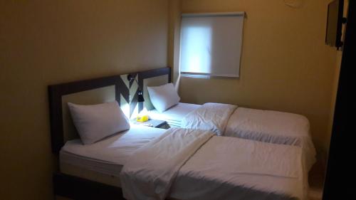 Кровать или кровати в номере City Inn Antang