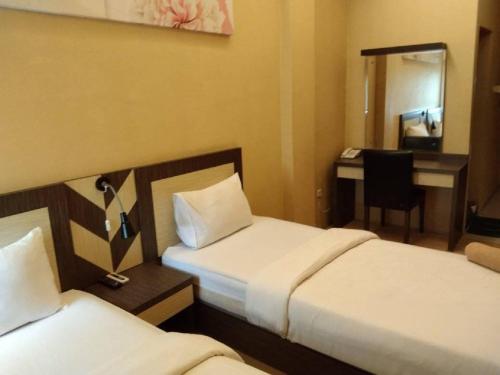 Кровать или кровати в номере City Inn Antang