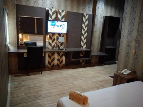 Телевизор и/или развлекательный центр в City Inn Antang