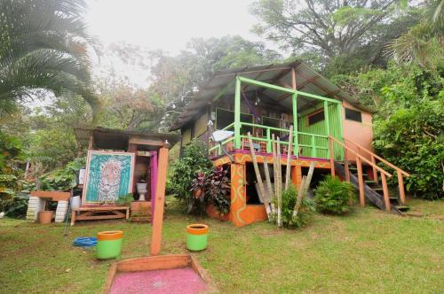 a small house with a staircase leading up to it at Cabañas Ecobiosfera in Catemaco