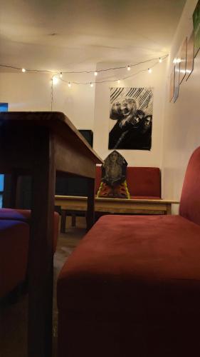 a living room with a piano and a couch at Mundo Viajero Saphy in Cusco