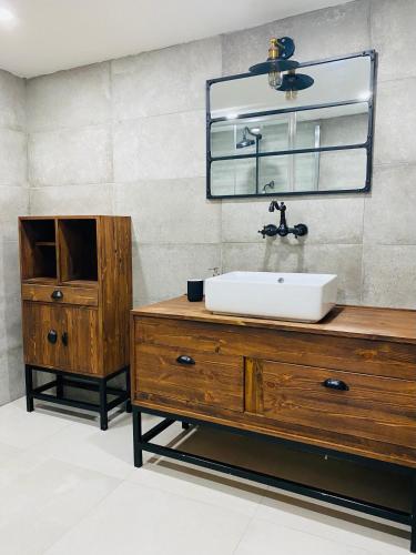 a bathroom with a sink and a mirror at 248 Boutique Studios, Sliema in Sliema