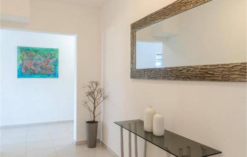 a living room with a mirror and a table at Lovely Apartment In Prizba With Wifi in Prizba