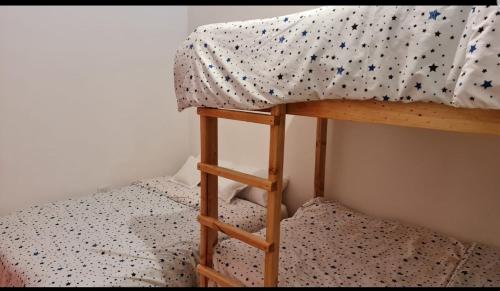 a bunk bed in a room with a bunk bed at Finca Pradera Real in Circasia