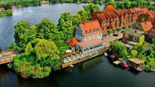 an aerial view of a town on a river at Restaurant und Hotel Zum Weissen Ross in Mölln