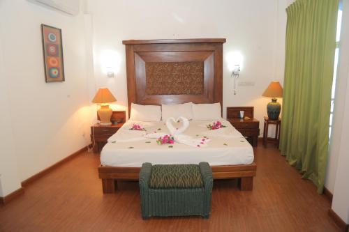 Postel nebo postele na pokoji v ubytování Laluna Ayurveda Resort