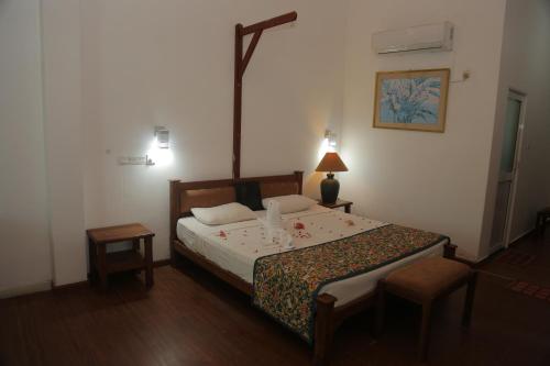 Postel nebo postele na pokoji v ubytování Laluna Ayurveda Resort