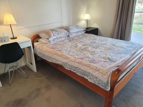 Ένα ή περισσότερα κρεβάτια σε δωμάτιο στο Parlour Mountain Cottage