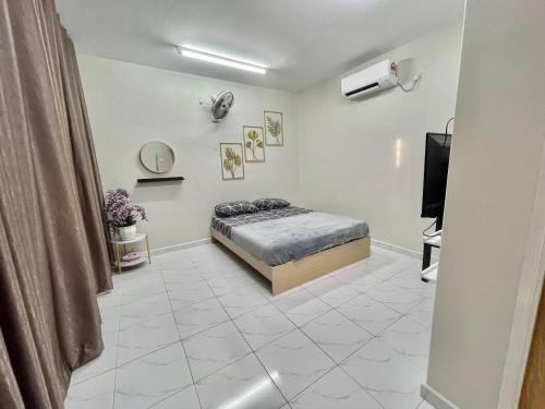 Ένα ή περισσότερα κρεβάτια σε δωμάτιο στο Aufa Roomstay