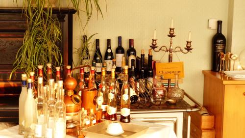 a bunch of bottles of wine on a table at Restaurant und Hotel Zum Weissen Ross in Mölln