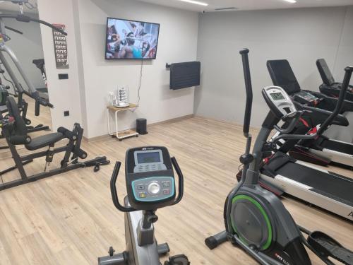 a gym with cardio equipment and a treadmill at Hyperion City Hotel & Spa in Chania Town