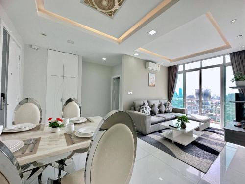 a living room with a couch and a table at Infinity 28 Hotel and Residence in Phnom Penh