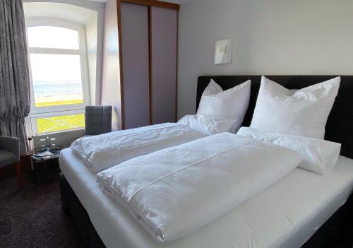 Katil atau katil-katil dalam bilik di Strandvilla an der Kaiserwiese