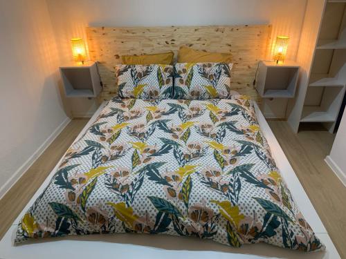 Un pat sau paturi într-o cameră la Chouett'Appart proche frontières