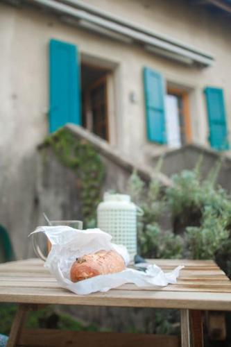 a pastry sitting on a table on a picnic table at Charming Vinyard House - Lake Geneva in Mont-sur-Rolle