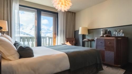 Postel nebo postele na pokoji v ubytování Le Fitz Roy, a Beaumier hotel