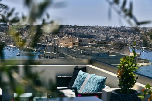 a view of a city from a balcony at Palazzo Ignazio in Valletta