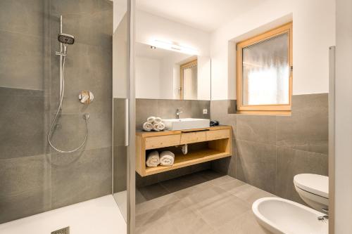 a bathroom with a shower and a sink at Neuhuberhof in Vols am Schlern