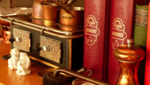 a group of books sitting on top of a table at Restaurant und Hotel Zum Weissen Ross in Mölln
