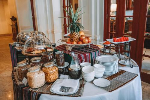a buffet of food on a table with plates at Settha Palace Hotel in Vientiane