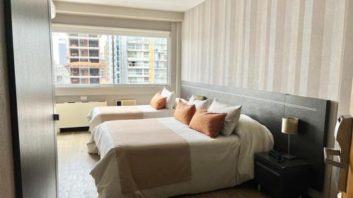 Postel nebo postele na pokoji v ubytování Sarum Hotel Design