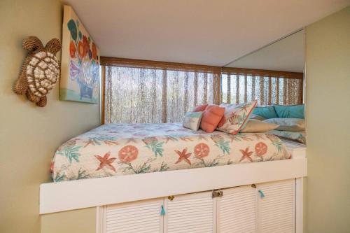 En eller flere senge i et værelse på Kealia Resort 506