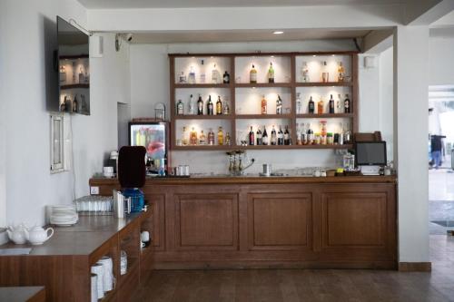 a room with a counter with bottles on shelves at Aranya Boutique Hotel in Kathmandu
