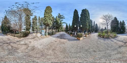 a park with trees and a gravel road at Urban Park Hotels in Tbilisi City