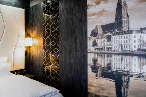 a hotel room with a view of a river at PLAZA Premium Schwerin Sure Hotel Collection by Best Western in Schwerin