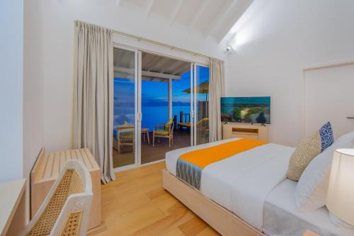 Postel nebo postele na pokoji v ubytování Dhigufaru Island Resort