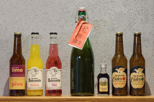 a group of bottles of beer on a shelf at Rezidence Za Vodou - Ledňáček in Cerny Dul
