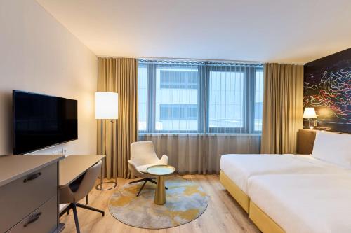 Postel nebo postele na pokoji v ubytování Radisson Blu Hotel, Lucerne