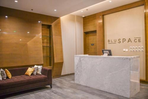 a lobby with a couch in front of a building at Radisson Blu Hotel, Juba in Juba