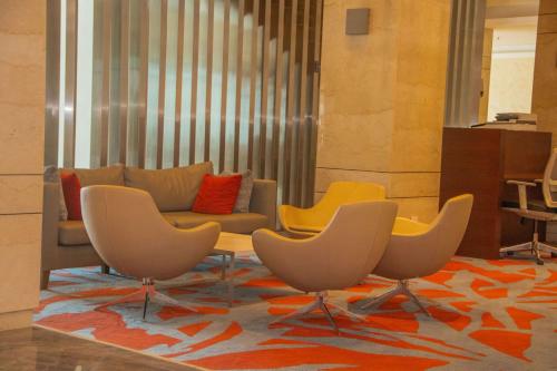 a living room with chairs and a couch at Radisson Blu Hotel, Juba in Juba