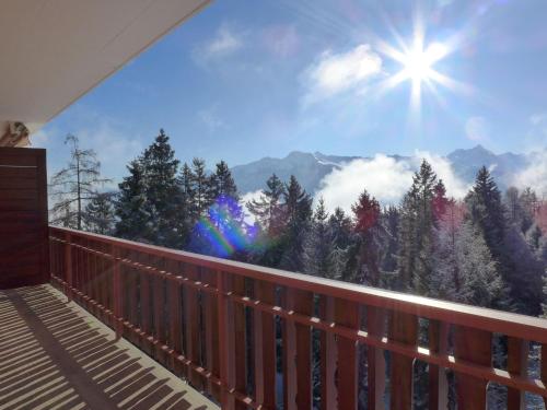a balcony with a view of the mountains at Apartment Les Faverges 8 by Interhome in Crans-Montana