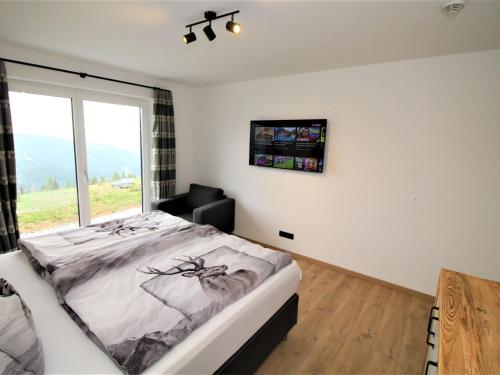Ένα ή περισσότερα κρεβάτια σε δωμάτιο στο Chalet Mountain Lodge - Klippitztörl by Interhome