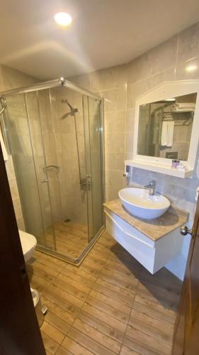 a bathroom with a shower and a sink at Kaleici Hotel in Antalya