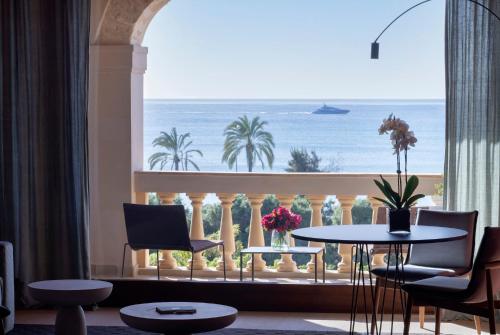 a room with a large window with a view of the ocean at Hotel Calatrava in Palma de Mallorca