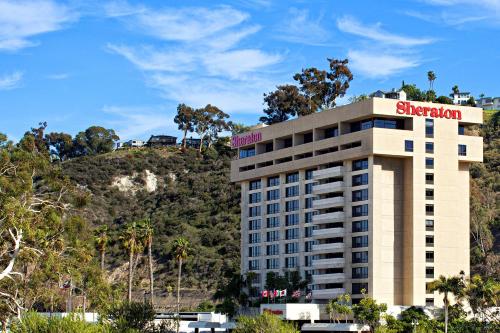 a hotel with a sheraton sign on top of it at Sheraton Mission Valley San Diego Hotel in San Diego