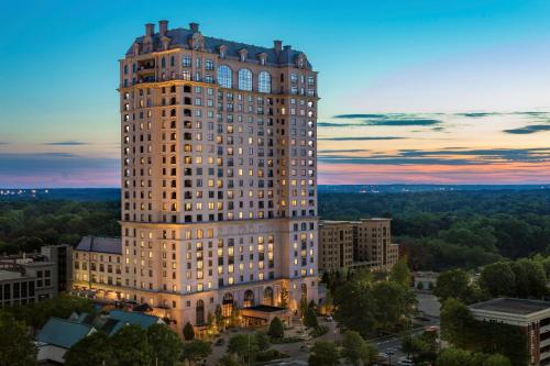 a rendering of a tall building at dusk at The St. Regis Atlanta in Atlanta