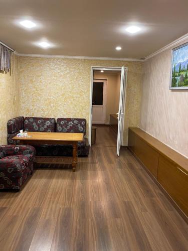 a living room with a couch and a table at Eco in Yerevan
