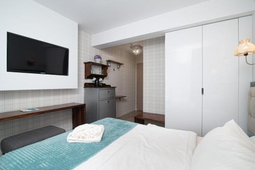 Postel nebo postele na pokoji v ubytování Adler Medical SPA Kaszuby