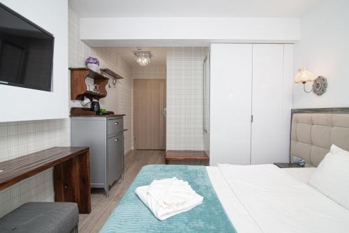 Postel nebo postele na pokoji v ubytování Adler Medical SPA Kaszuby