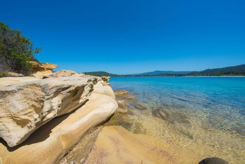 a view of the shore of a body of water at Nereus & Oceanus Beachfront Apartments, Lagonisi Beach #FeelsLikeHome in Ormos Panagias