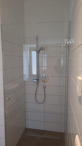 a bathroom with a shower with a glass door at Apartment Nordbergstrasse in Heilbronn