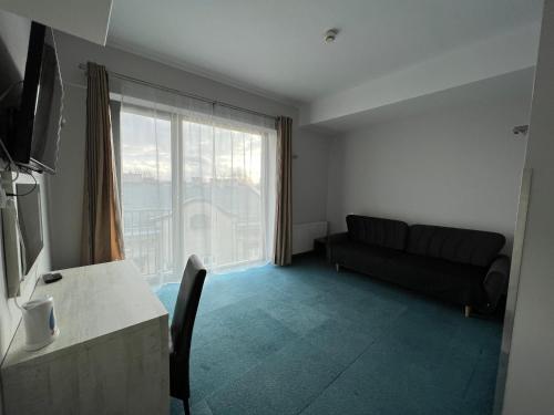 TV a/nebo společenská místnost v ubytování Hotel Poleski