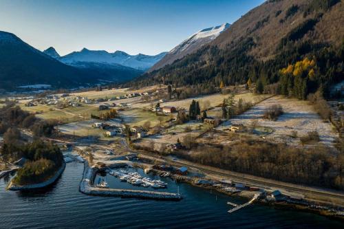 an aerial view of a marina with boats in the water at Moonvalley Lodge - stort & koselig hus - Måndalen in Sæbø