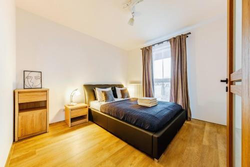 Ένα ή περισσότερα κρεβάτια σε δωμάτιο στο Aparthotel Plac Litewski Premium